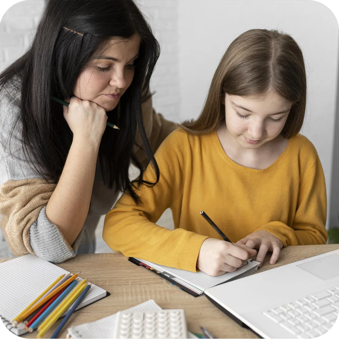 A child learning with support from an adult