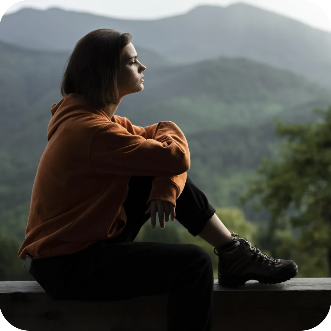 A young person taking a quiet moment outdoors