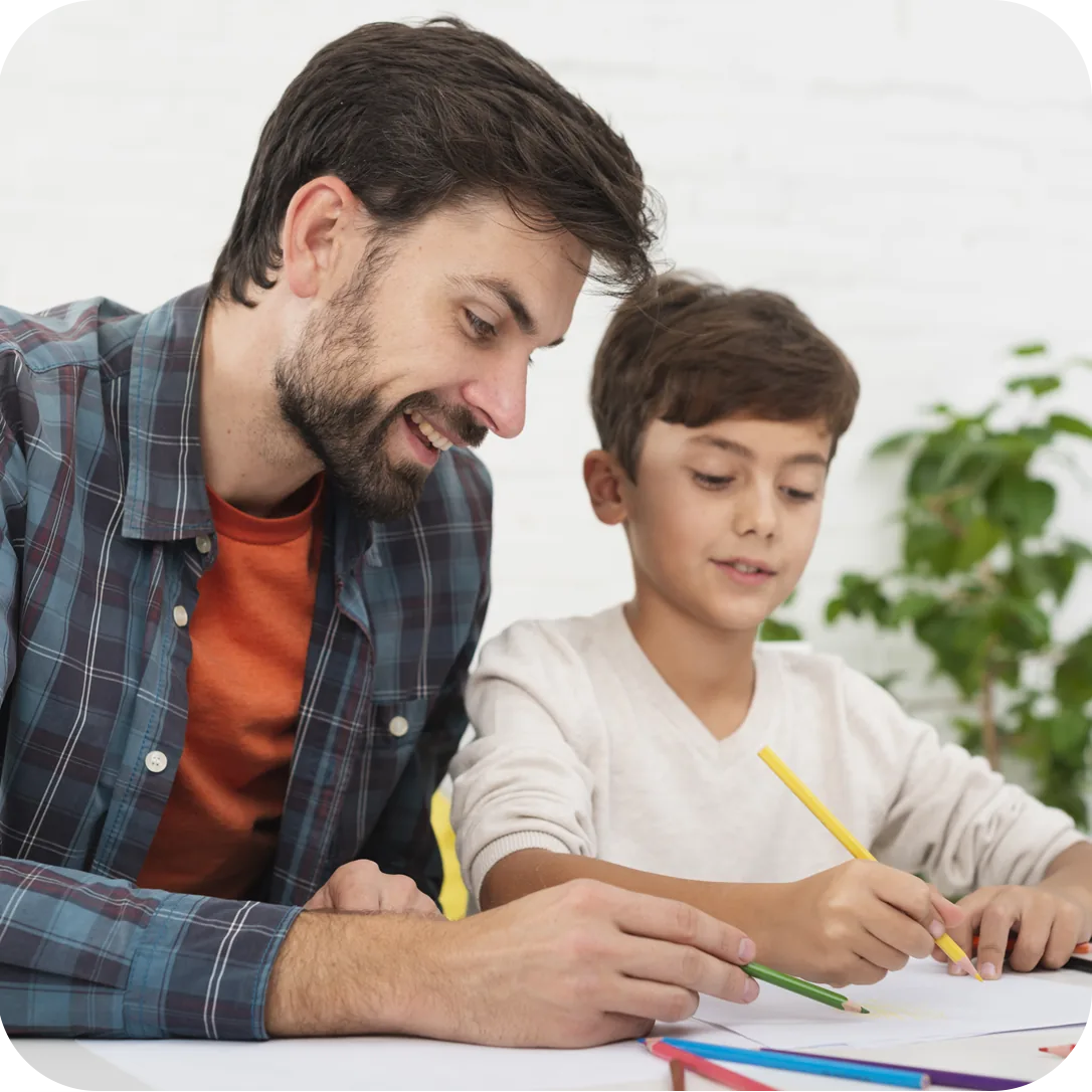 An adult helping a child with a writing activity